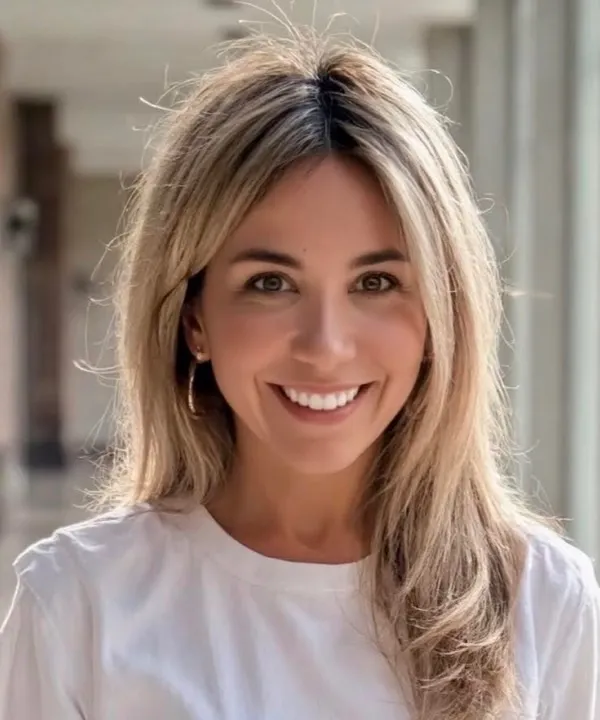 The founder of Balloon Works NYC, smiling, photographed outdoors in soft daylight.